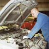 Photo of the Mechanic working on Car